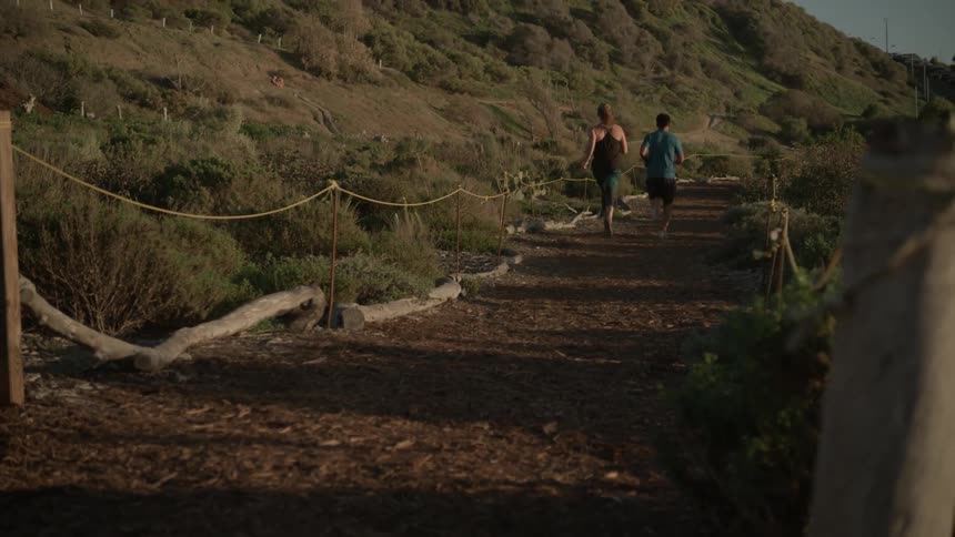 People jog down a roped off path