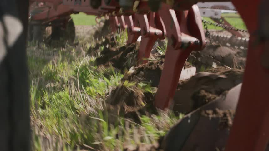 Farm equipment digs into the ground