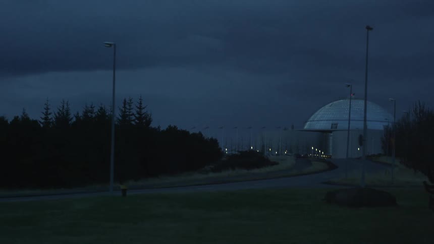 An observatory in the distance at night