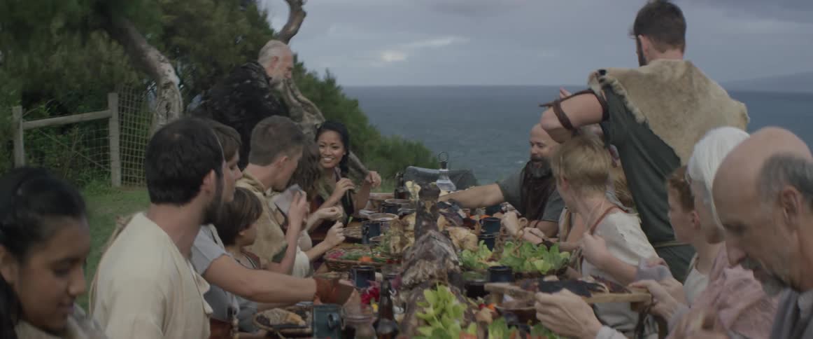 The table is full of people having a grand meal