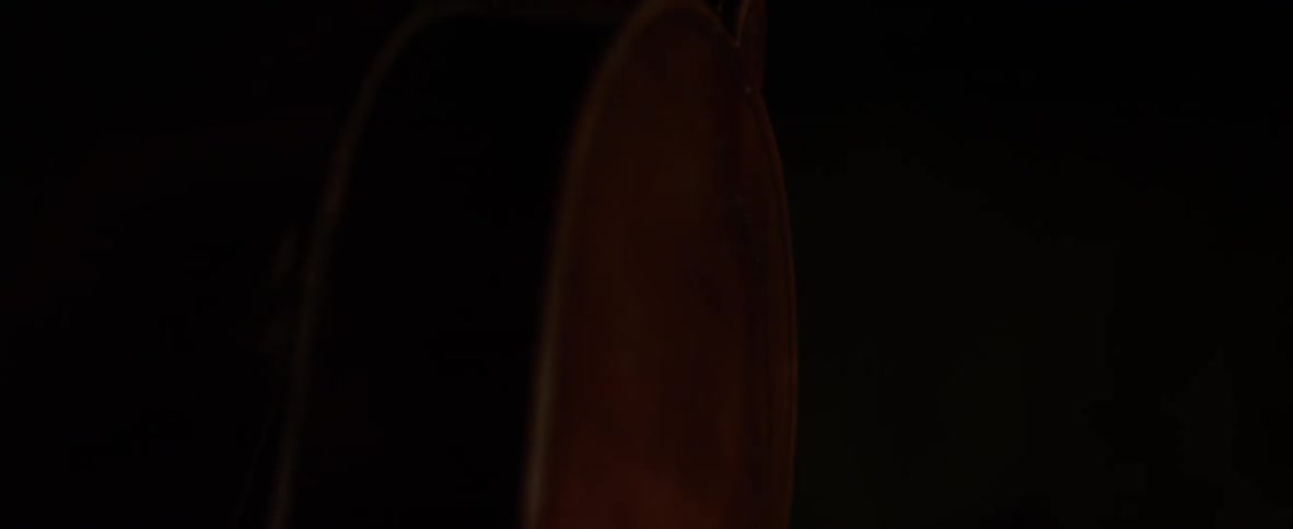 A violin is turned in the dark
