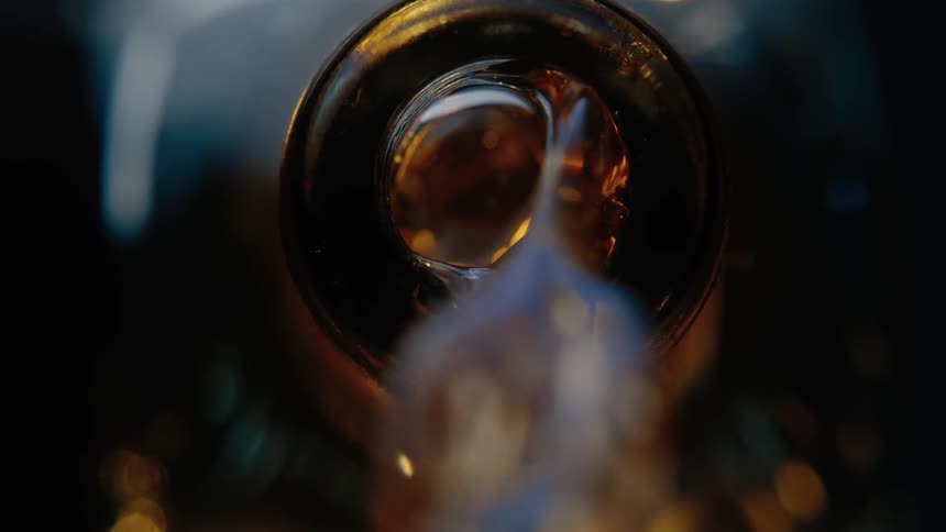 Liquor is being poured from a bottle