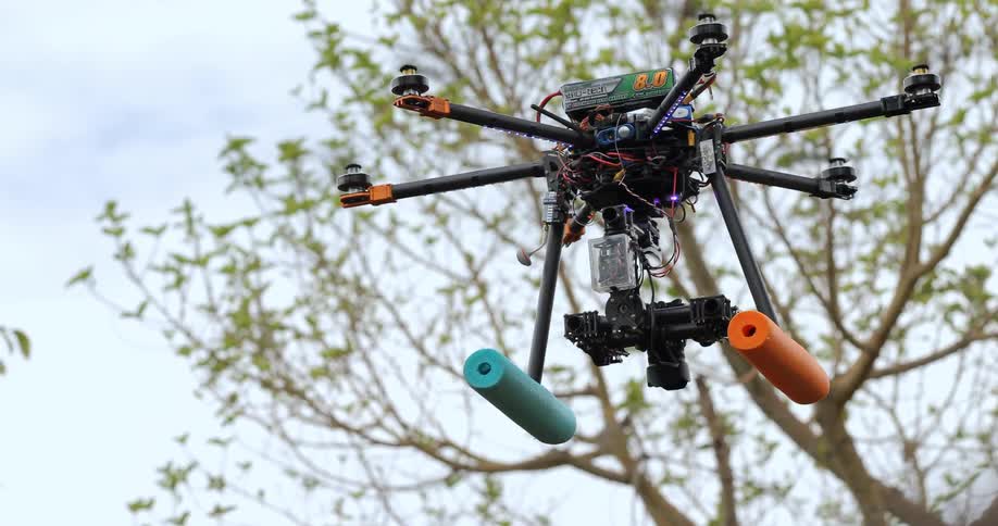 Close up of a drone as it takes off into the sky