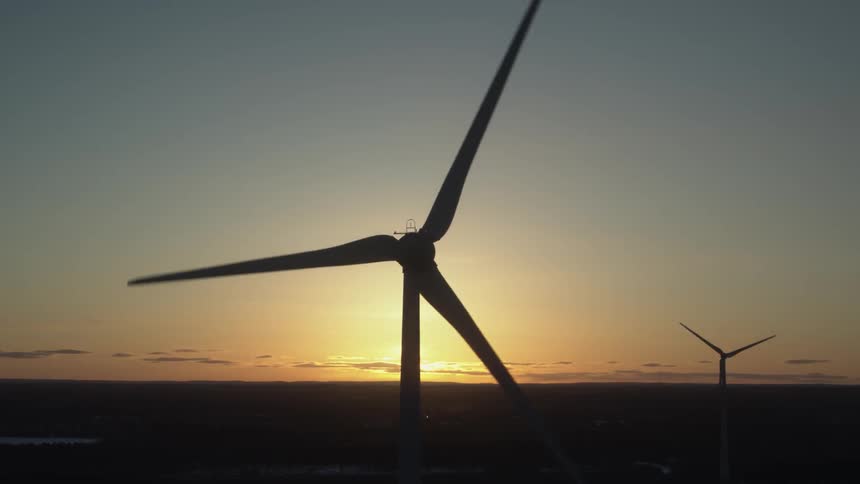 Windmills rotate in the sky