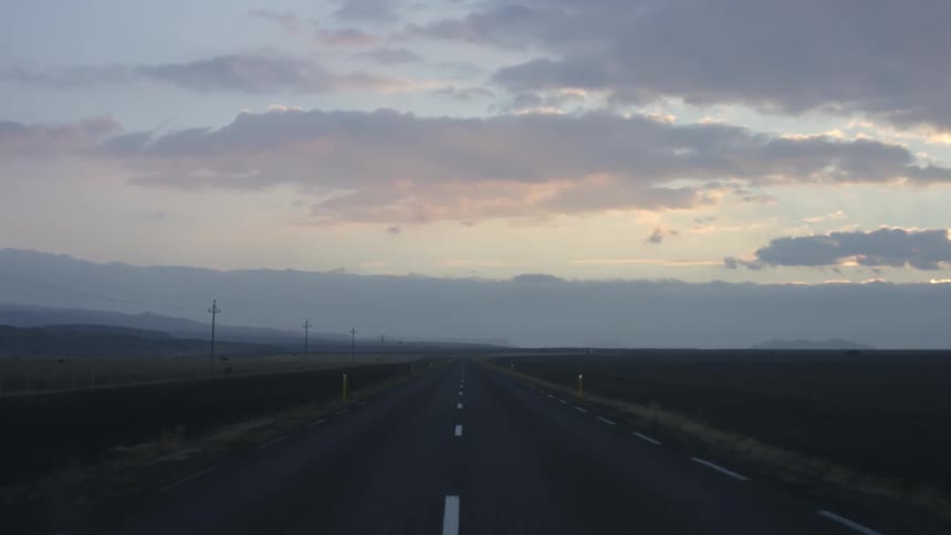 View of a highway at a cloudy sunset