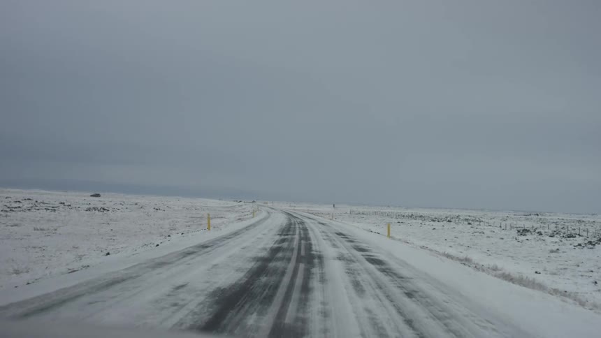 Driving down a snow covered street