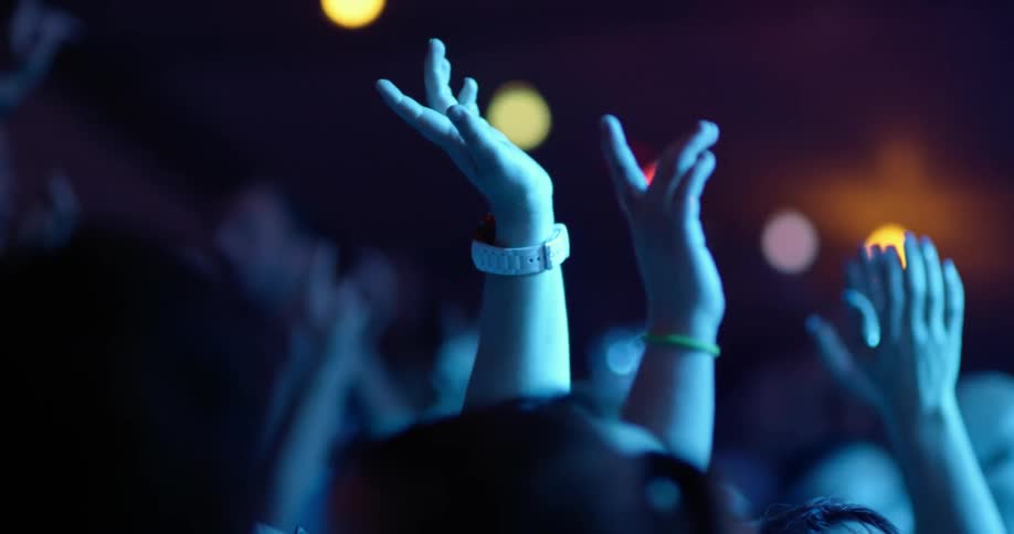 The crowds hands slowly raise to cheer