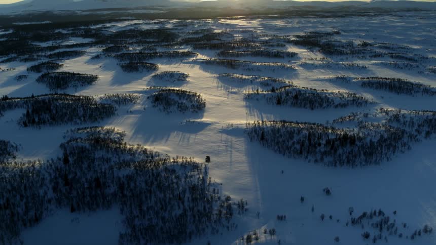 A drone is filming a frozen landscape