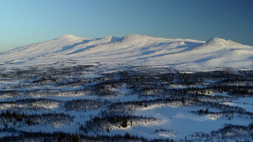 A drone is flying over a frozen landscape