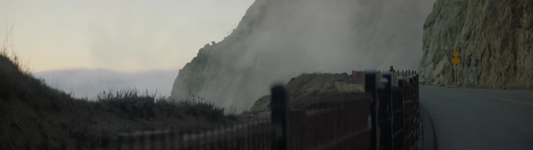 Mist and fog billow over the rocks