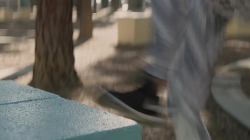 A woman hops and alternates putting her feet on a block while exercising outdoors