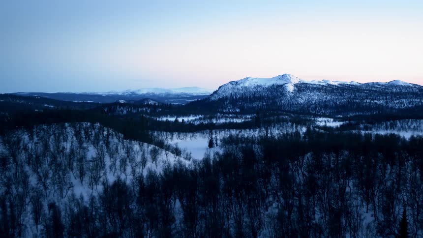 Over the mountains many trees can be seen on the side