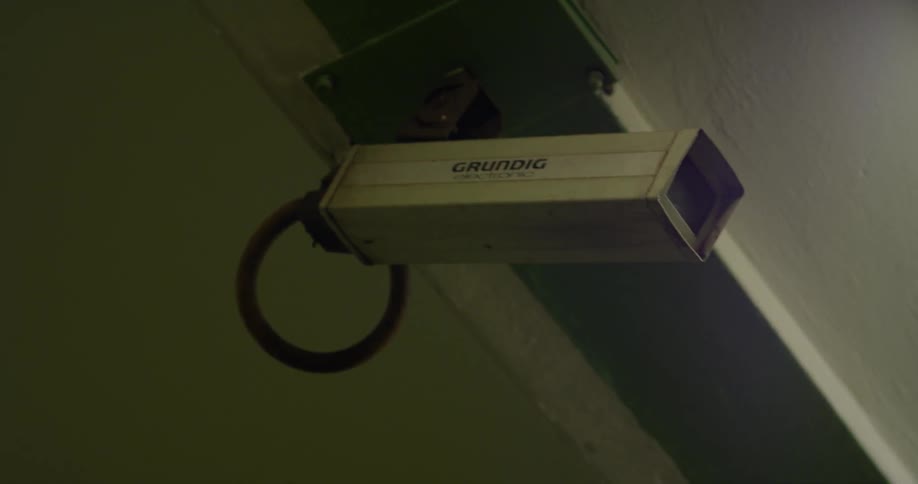A security camera is attached to a building