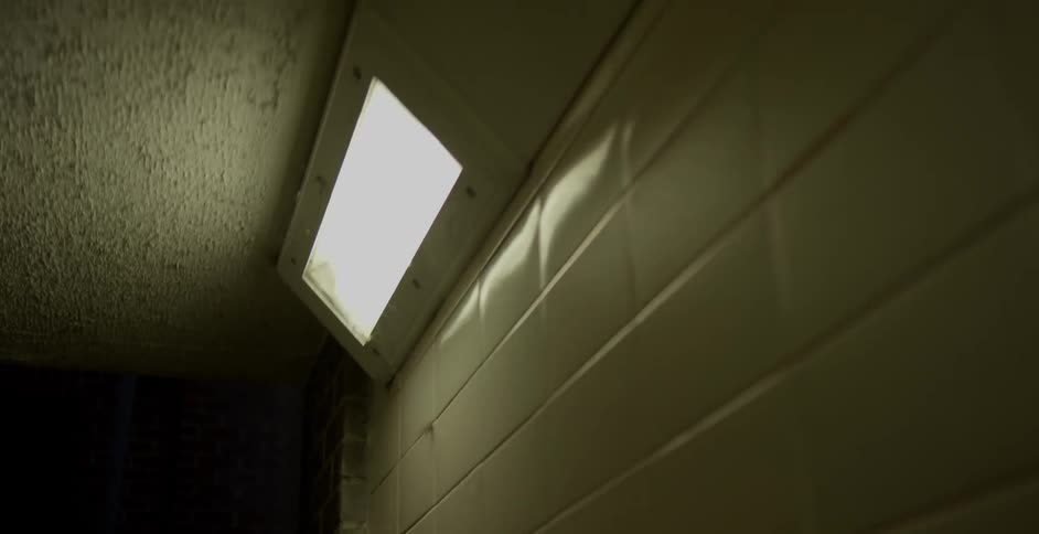 Fluorescent lights illuminate a hallway