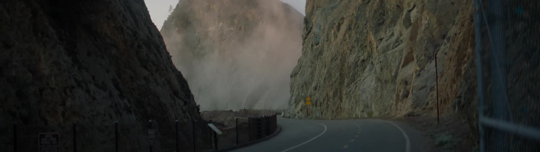 Fog floats in from between the mountains