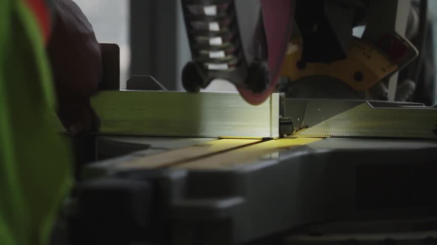 Machine saws into a piece of metal