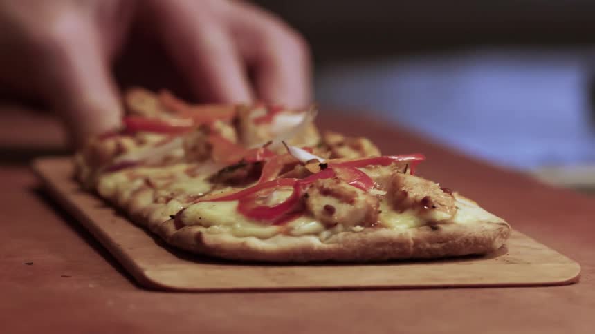 A pizza is put on a board for display