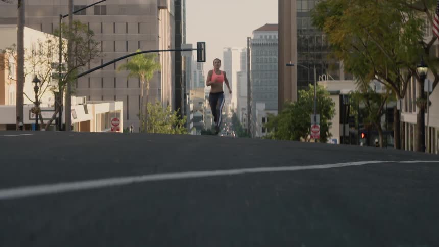 A woman is running through the city