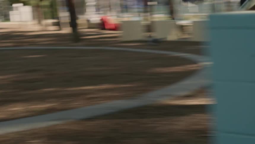 A woman is running then jumps over some boxes