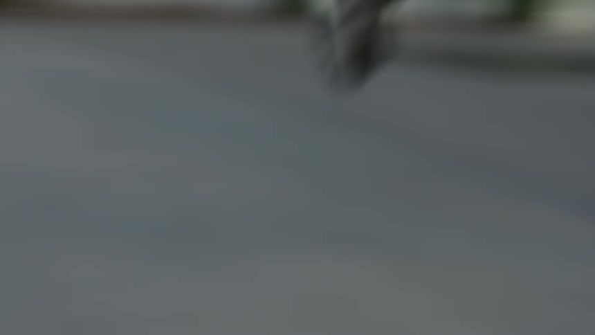 A man is running down the sidewalk