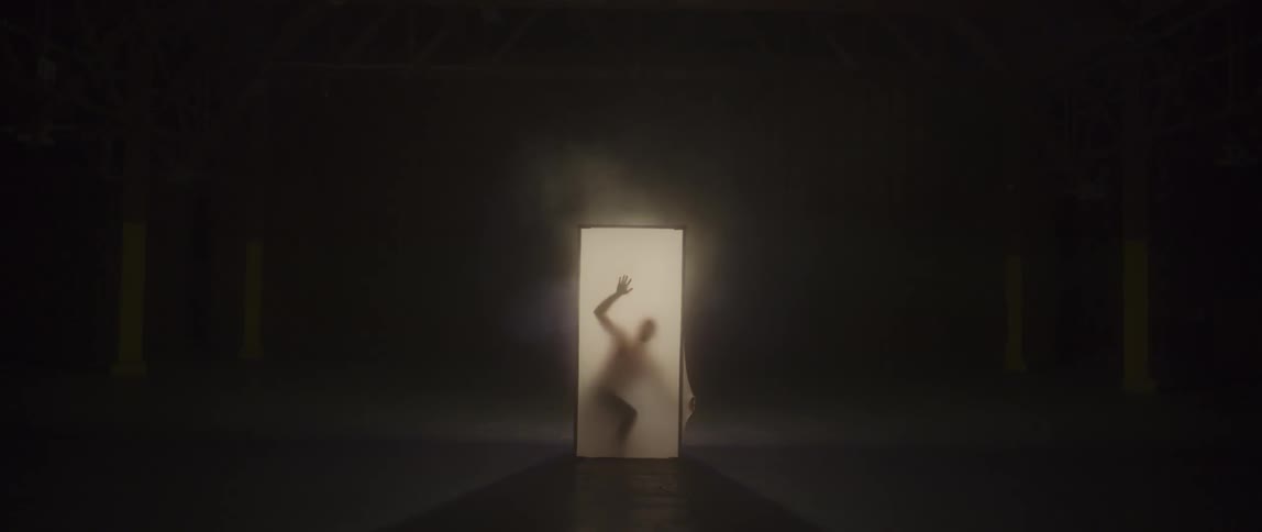 A person pushes against the sides of a fabric screen box