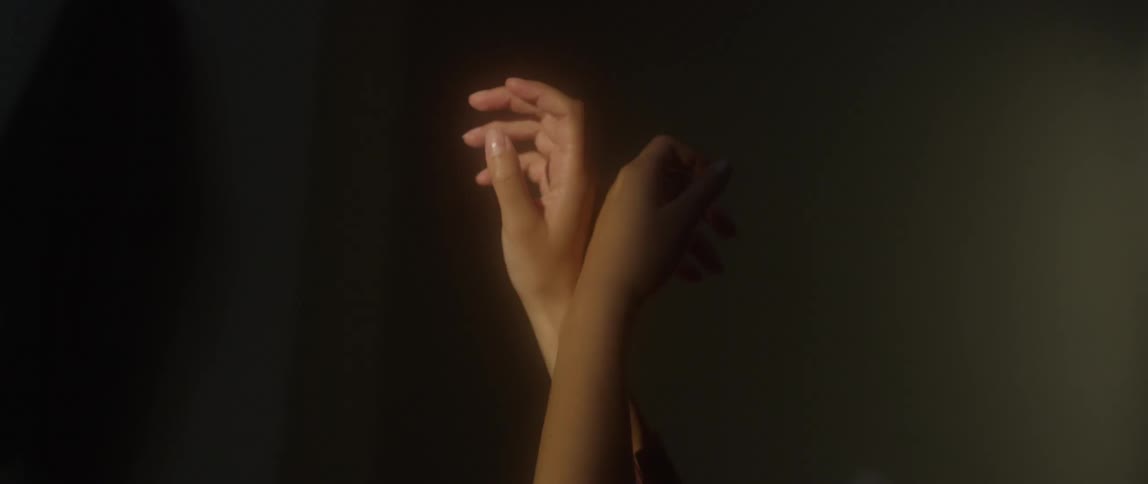 Woman's arms move together gracefully