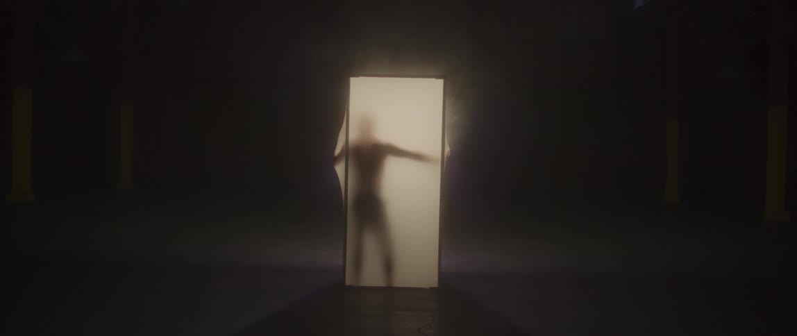 A man presses up against a lit screen