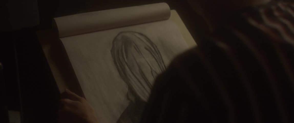 Someone is looking at a drawing they had just finished