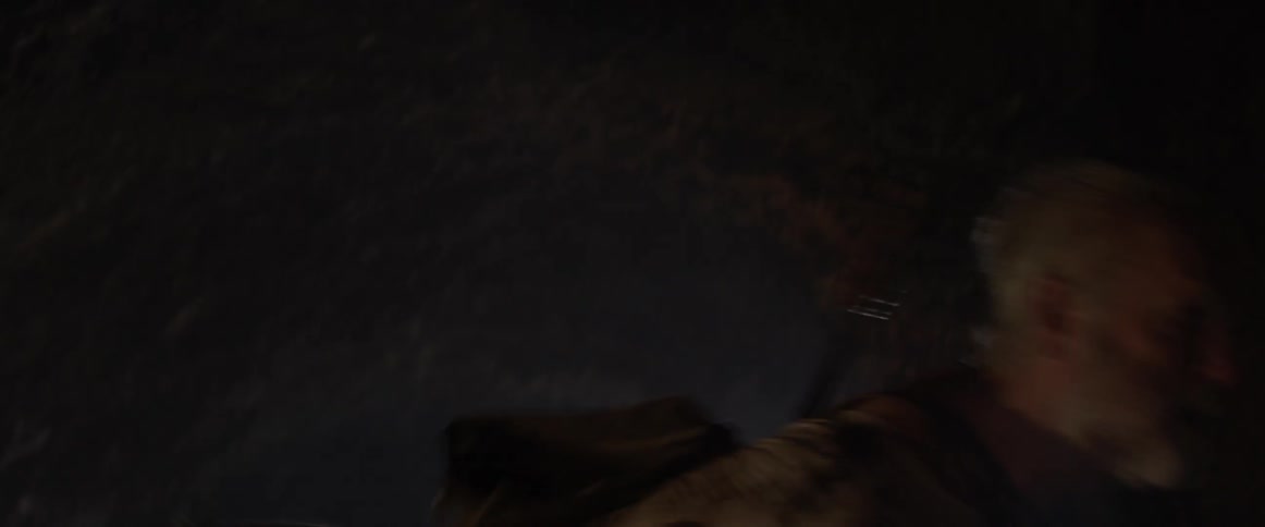Bearded man opens his mouth and swings his arm forcefully
