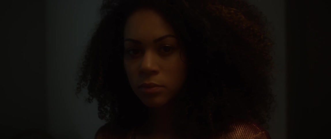 A woman opens her eyes and looks up