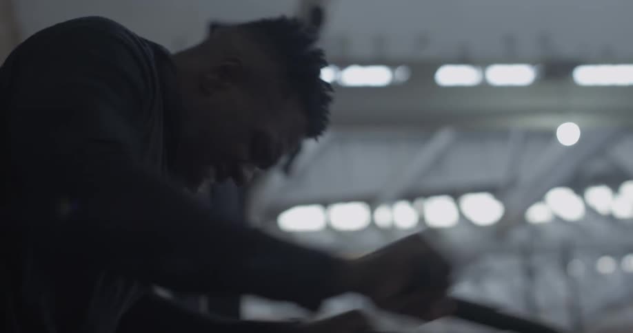 A man rides an exercise bike in a gym
