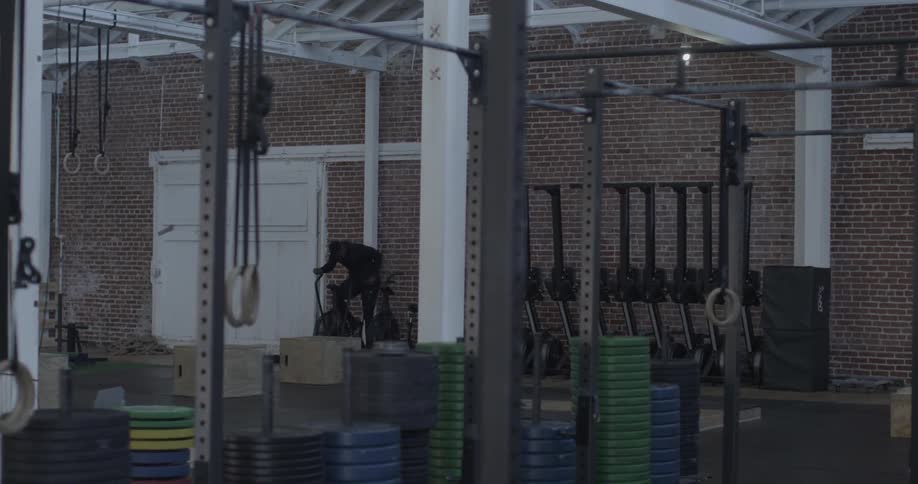 Person riding on a stationary bike in a gym