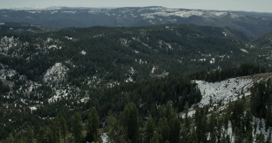 Snow covers the wooded mountain terrain in Lake Tahoe, California