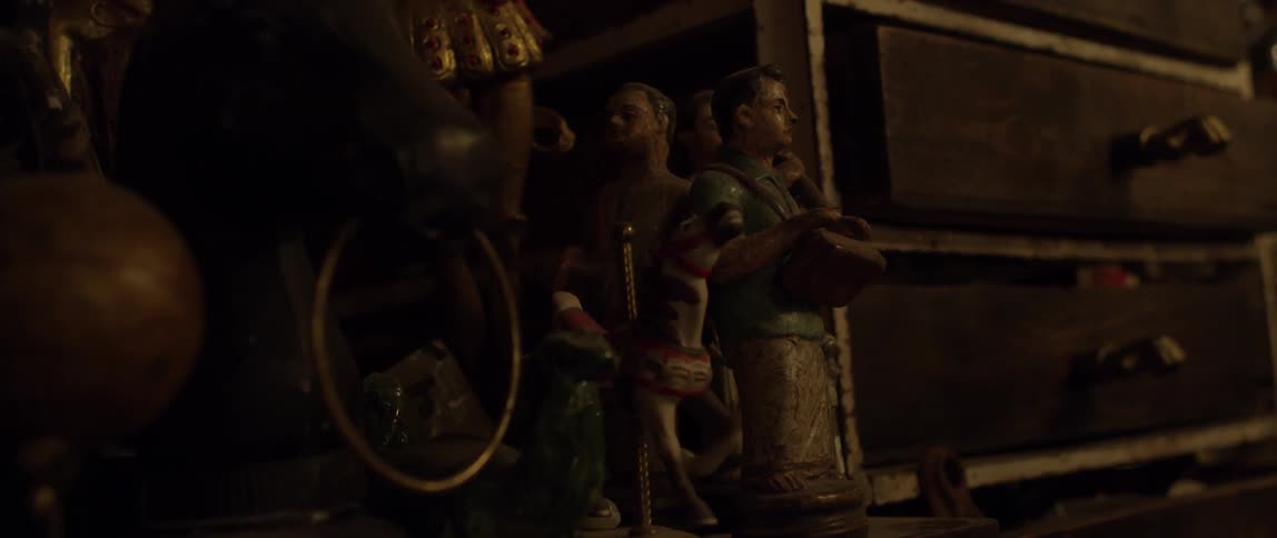 Figurines sit next to some drawers