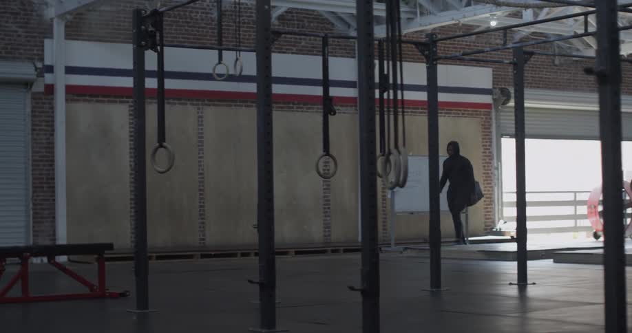 A man walks through the gym
