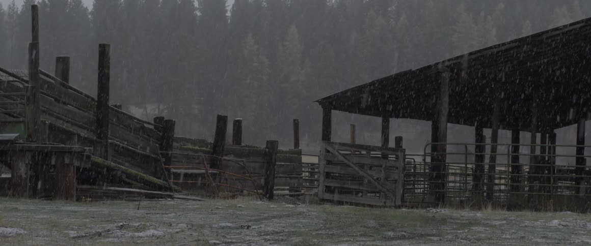 The farm has heavy rain falling down