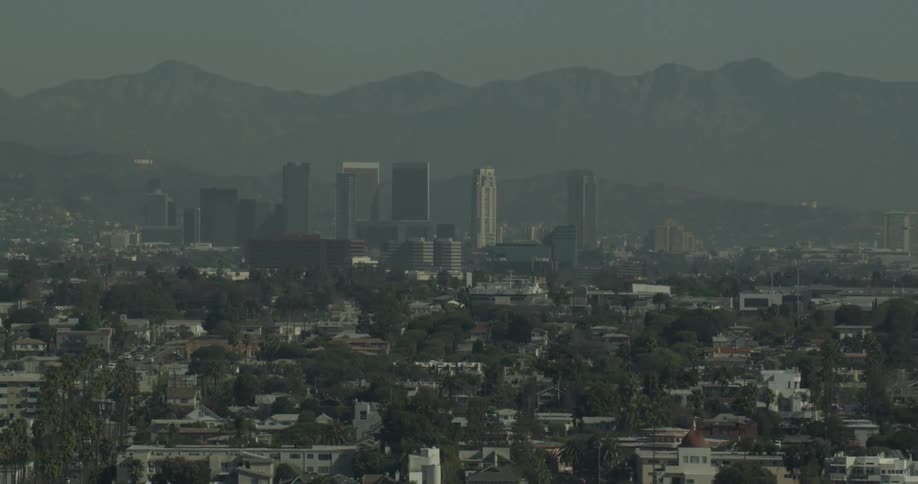 View of a large city in California with mountains in the background