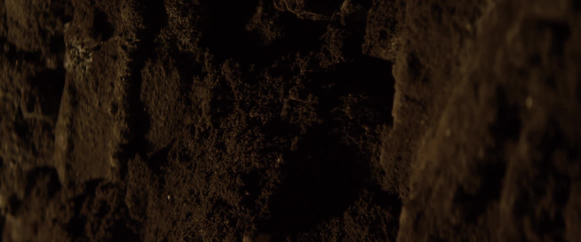 Dirt is disturbed and falls downward
