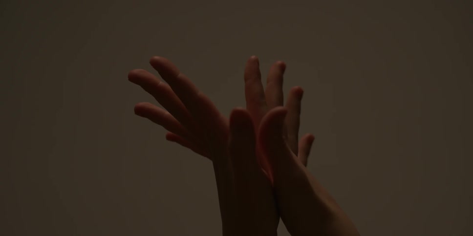 A hand is in the air stretching around