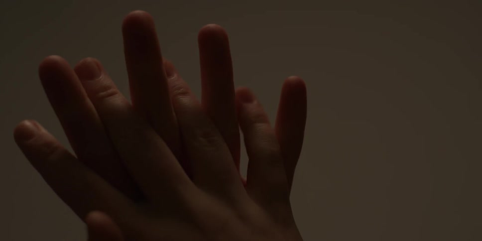 Two hands are rubbing together