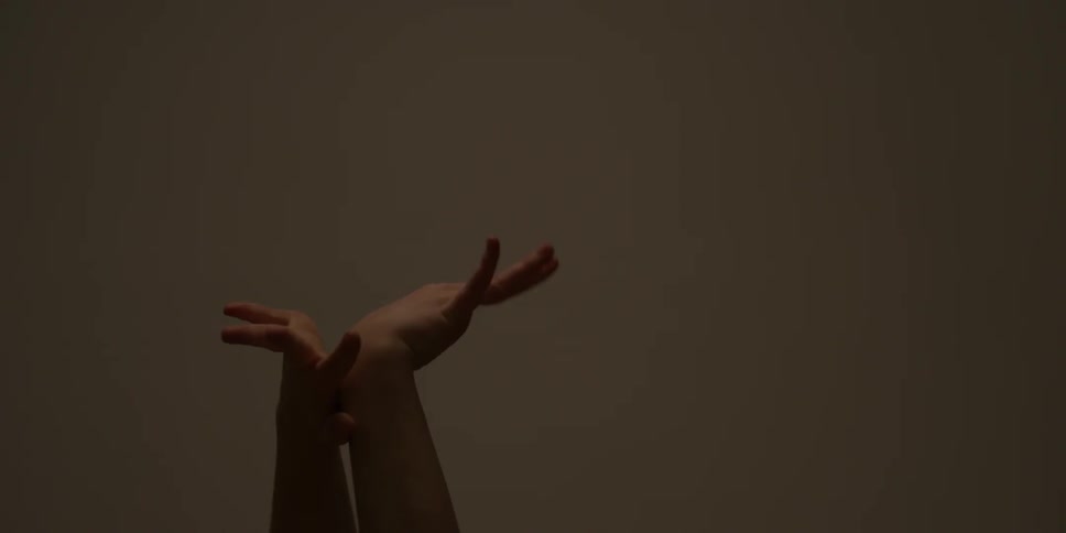 A woman holds her arms up and rotates