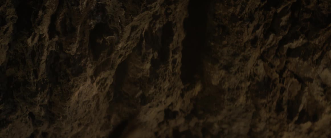 A man rips a steel chain from the wall