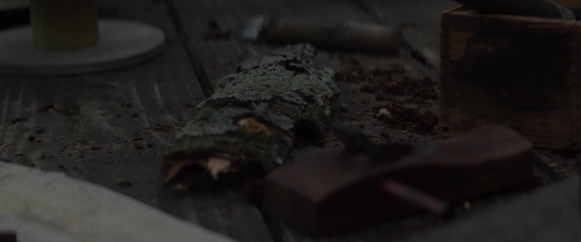 Broken wood sits atop wood decking