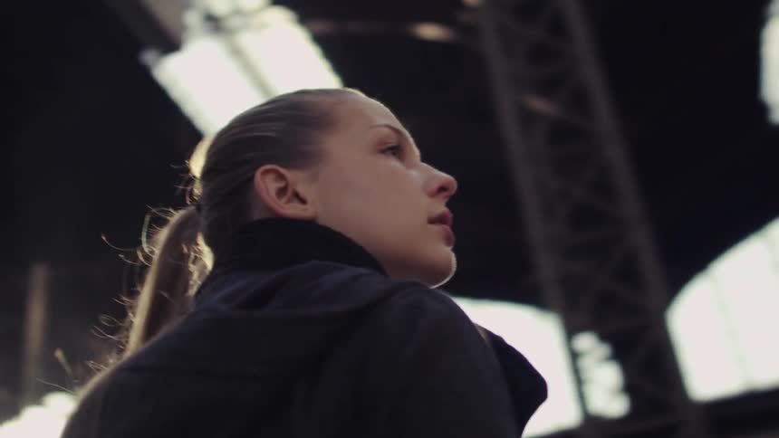 A woman looks around worried