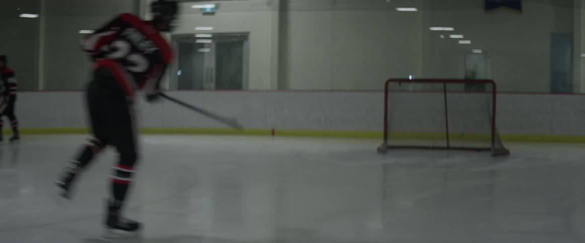 Hockey players are skating around practicing