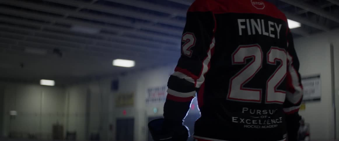 A hockey player slowly skates backward
