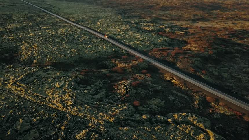 A truck is traveling down the road below in Iceland