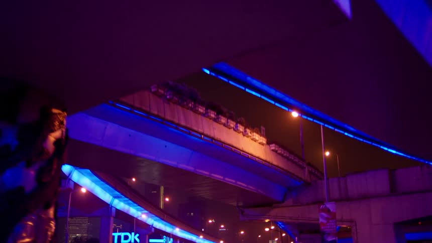 Highway overpasses are brightly lit from underneath