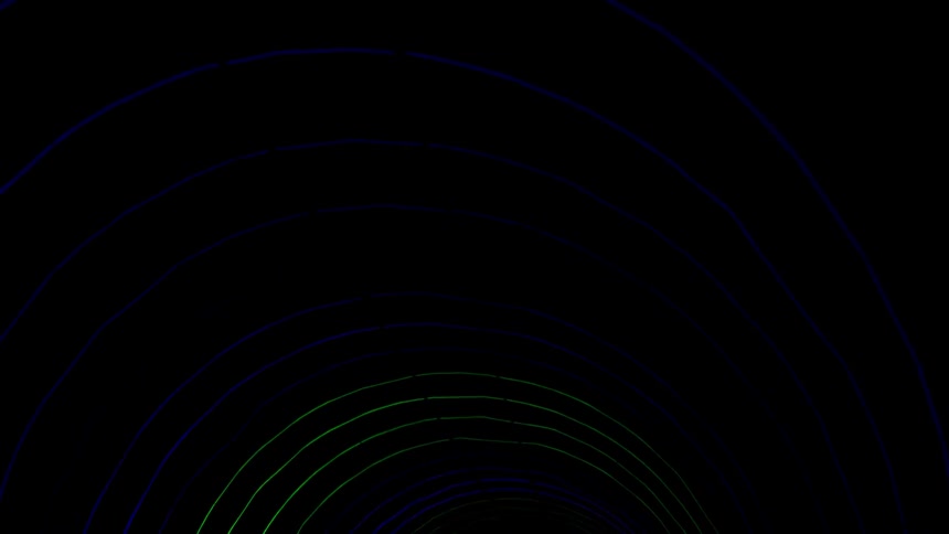 Someone is walking under rings of led lights