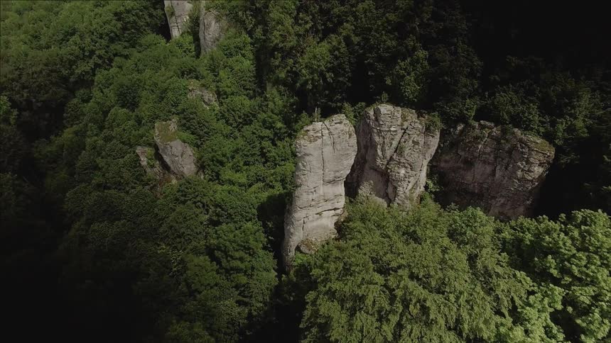 A drone is filming the side of a mountain